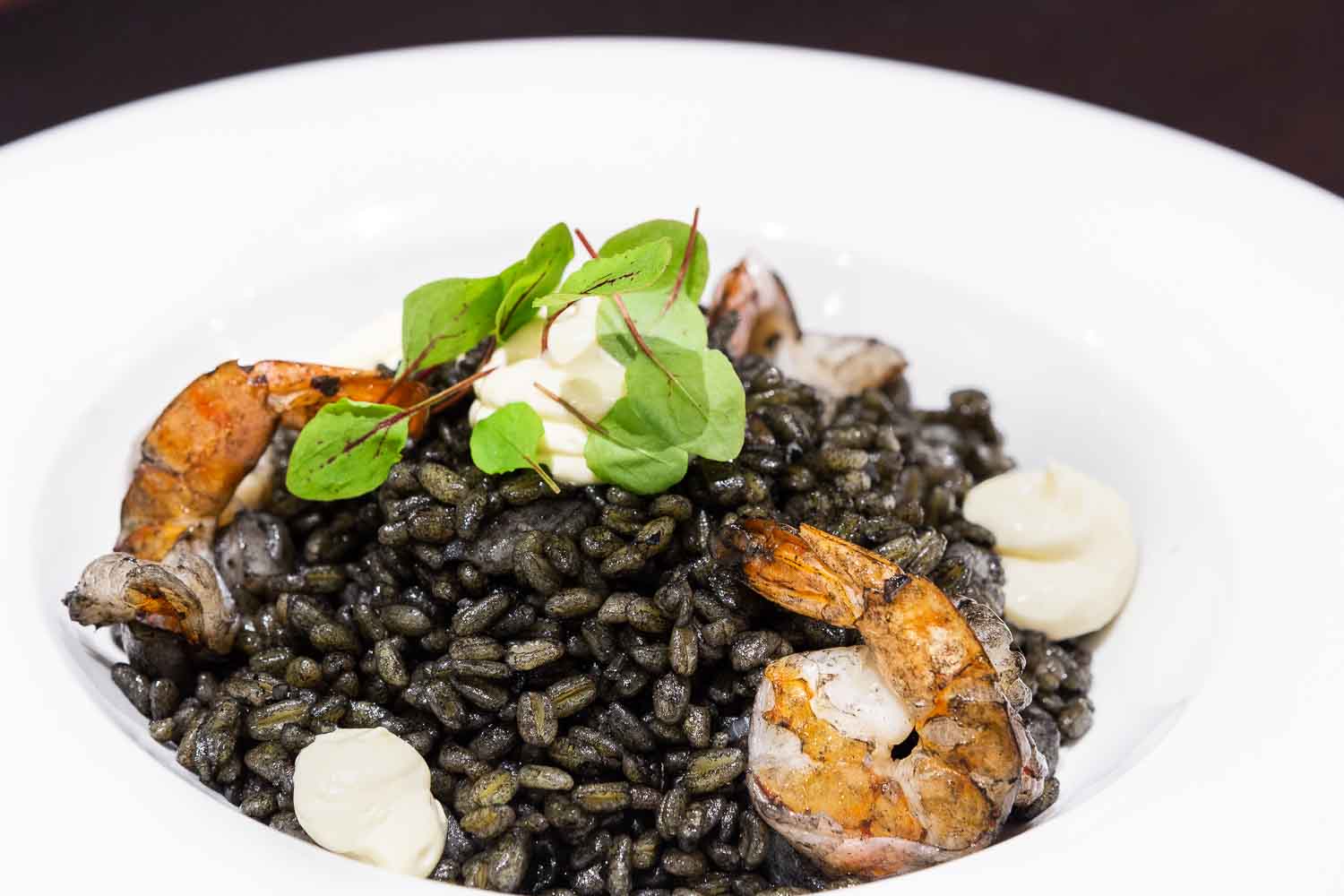 Black wheat risotto with cuttlefish, shrimp and garlic mayonnaise