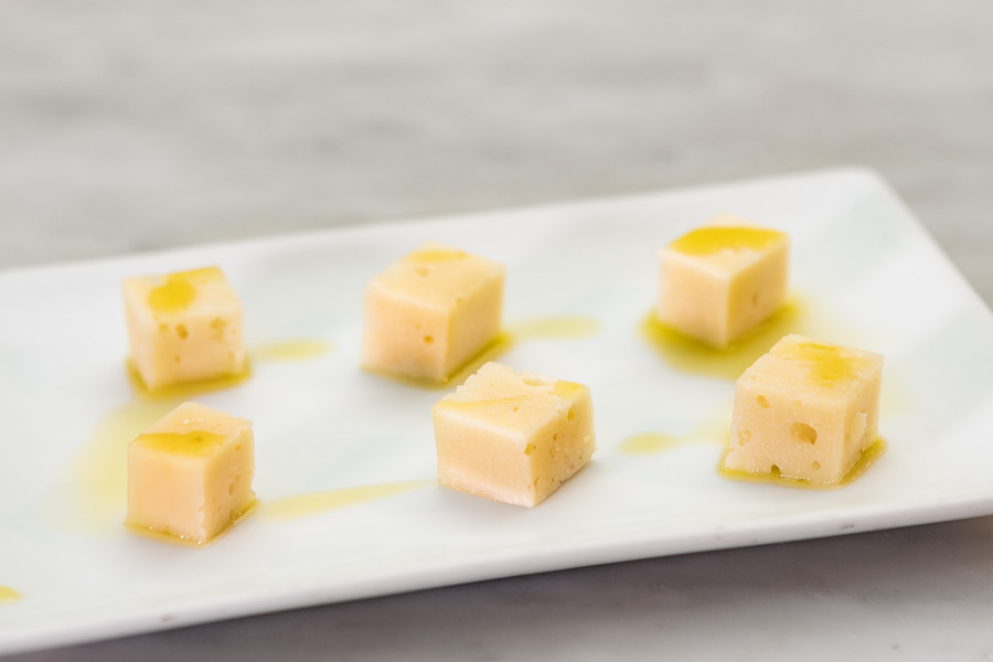 Chunks of pure mature sheep's cheese with a few drops of olive oil