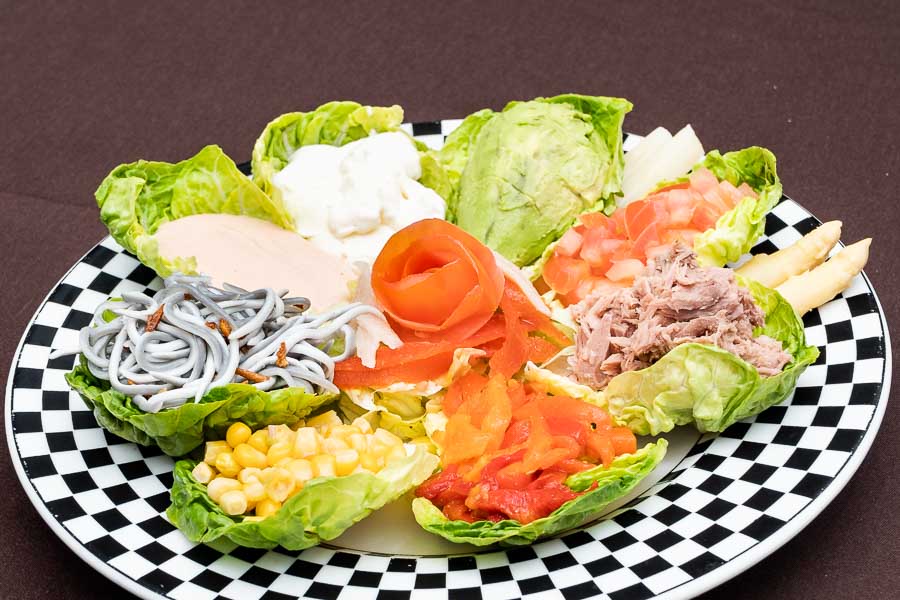 Salad with avocado, roasted pepper, tuna and corn