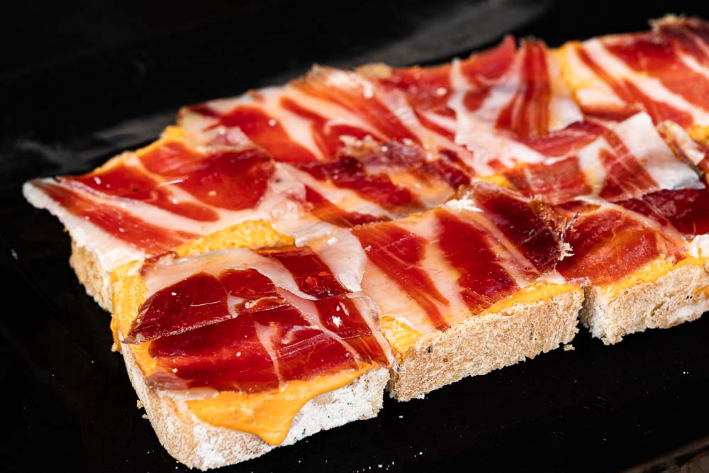 Cold Spanish cream of tomato and cured ham on a slice of toasted bread