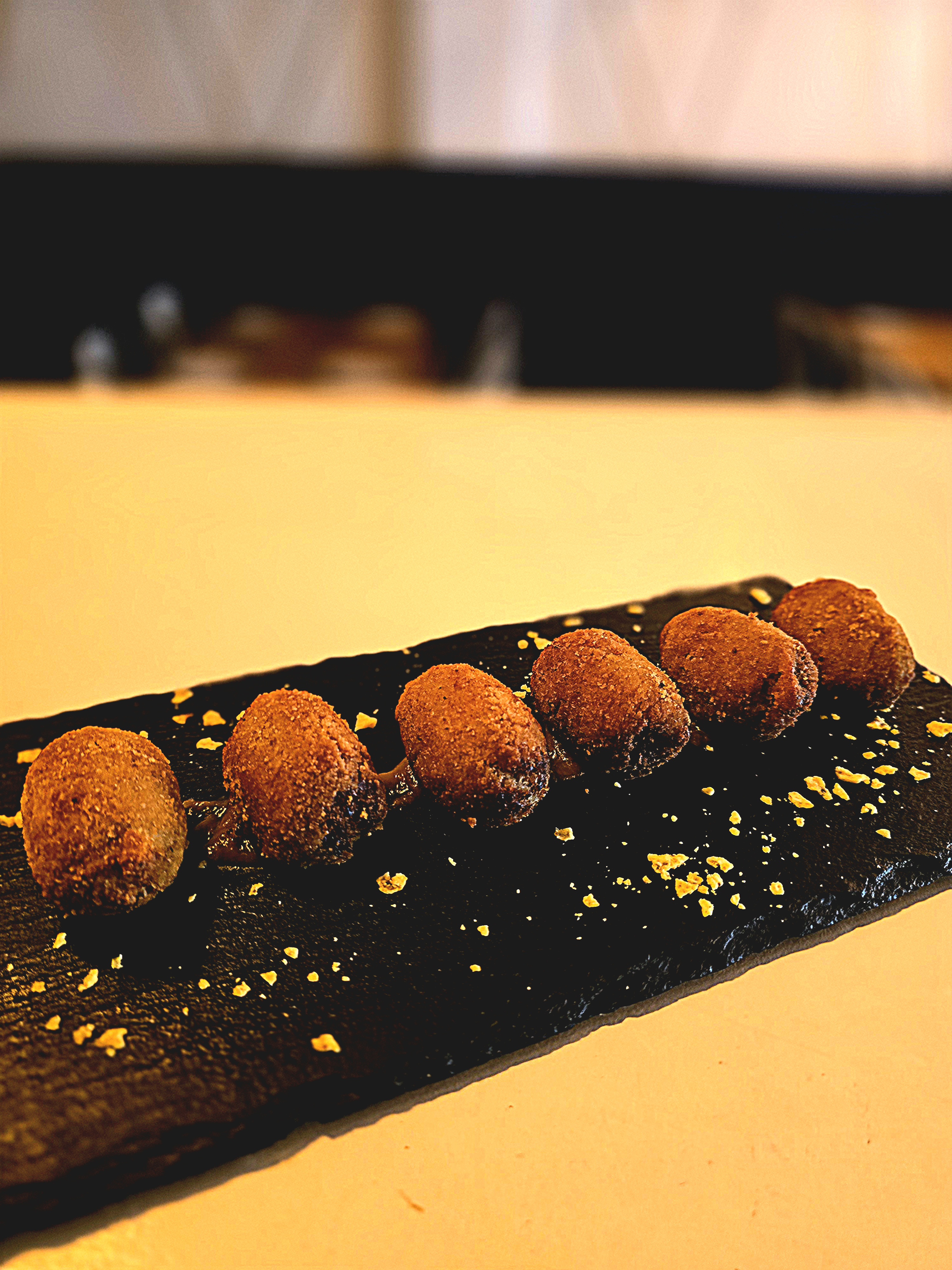 Cheek croquettes with caramelized apple sauce