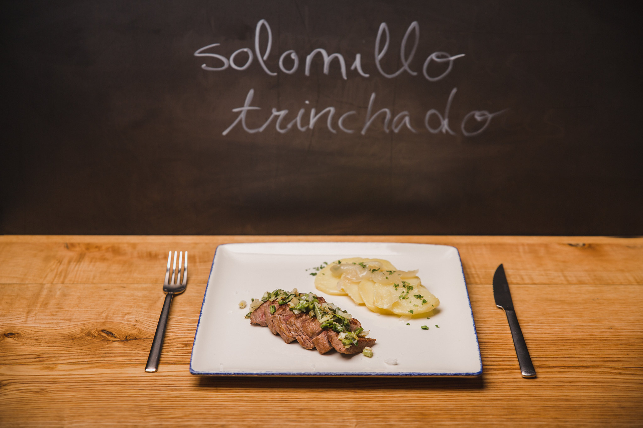 Carved sirloin with garlic sprouts