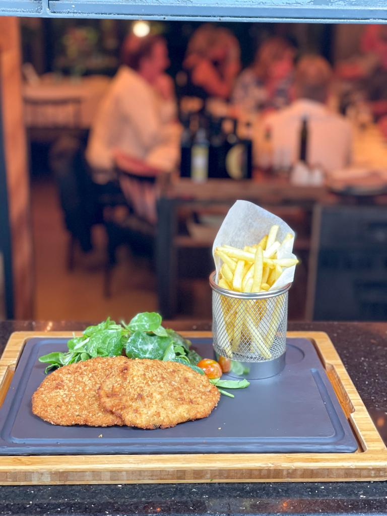 Italian breaded veal cutlets served with homemade french fries and salad 