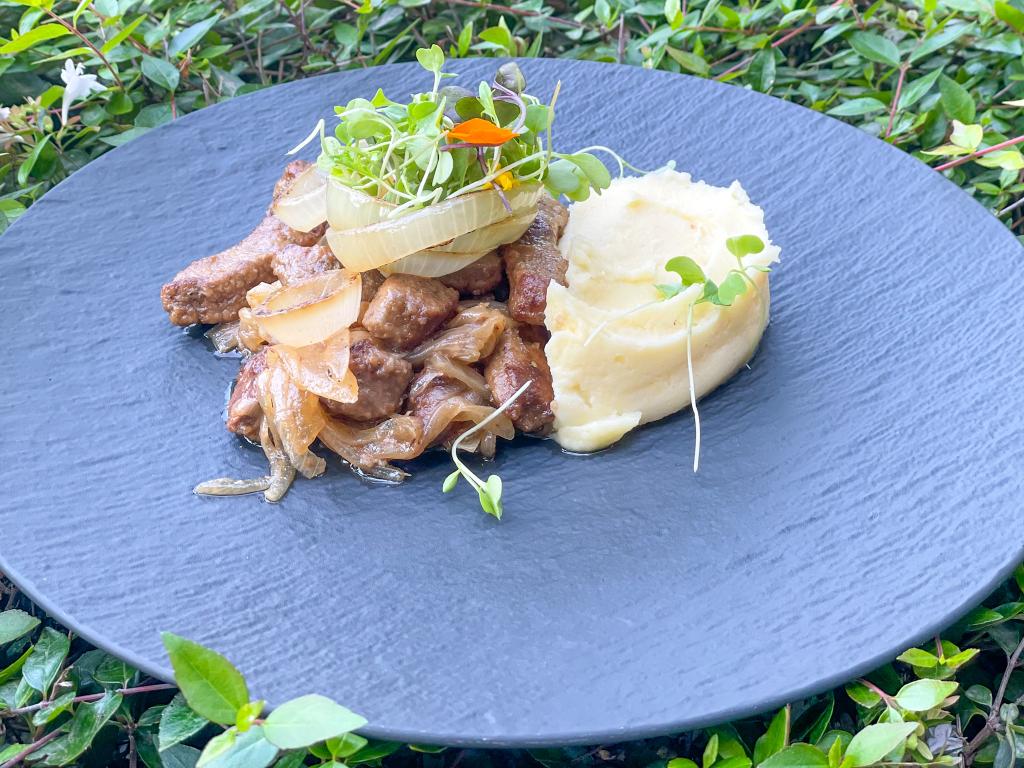 Venetian style veal liver with onions served with mashed potatoes