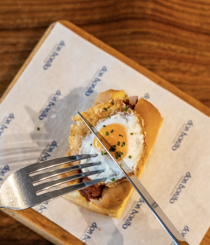 Chistorra hot dog with fried quail egg
