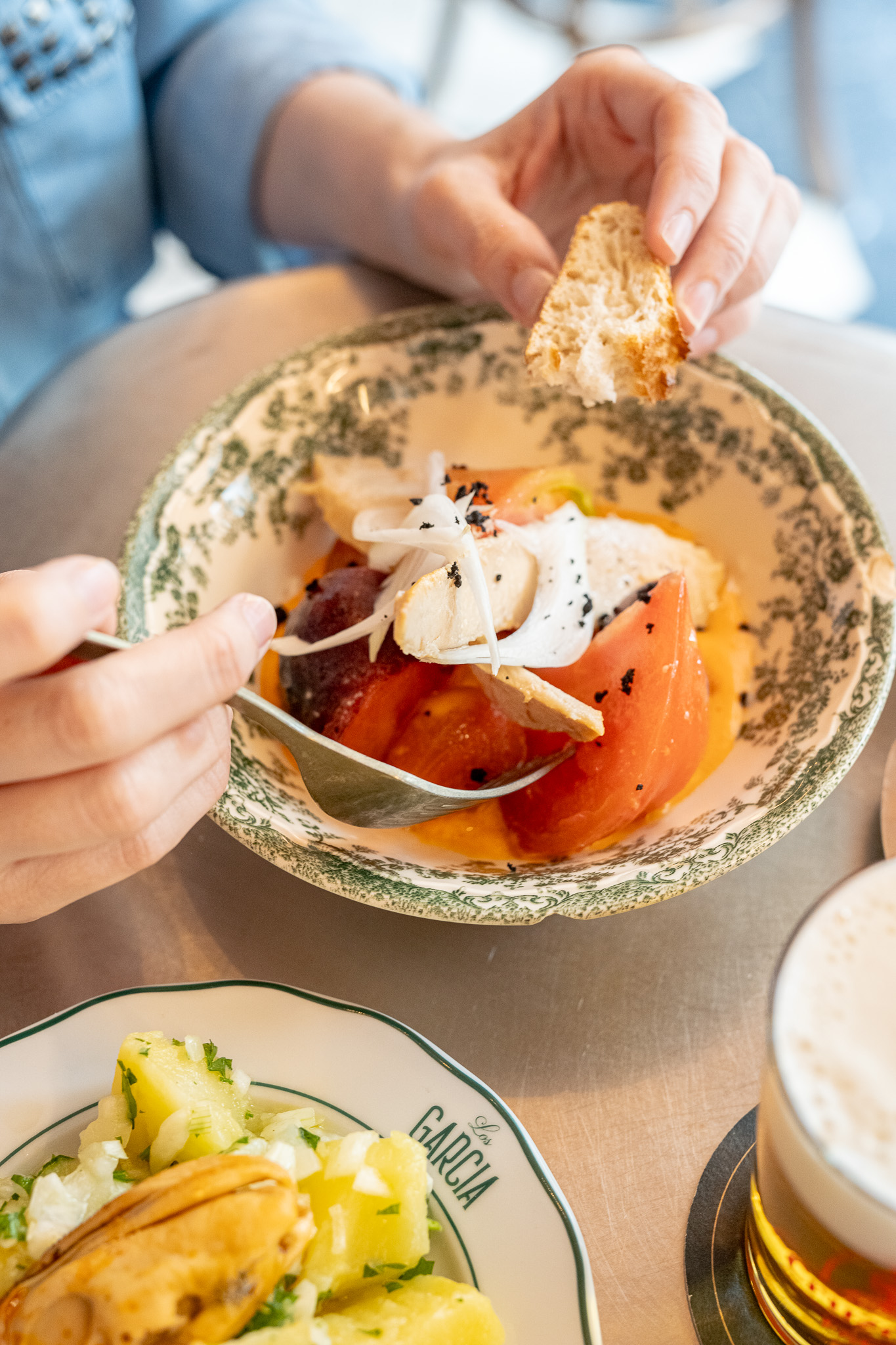 Dressed tomato with tuna belly and black olives
