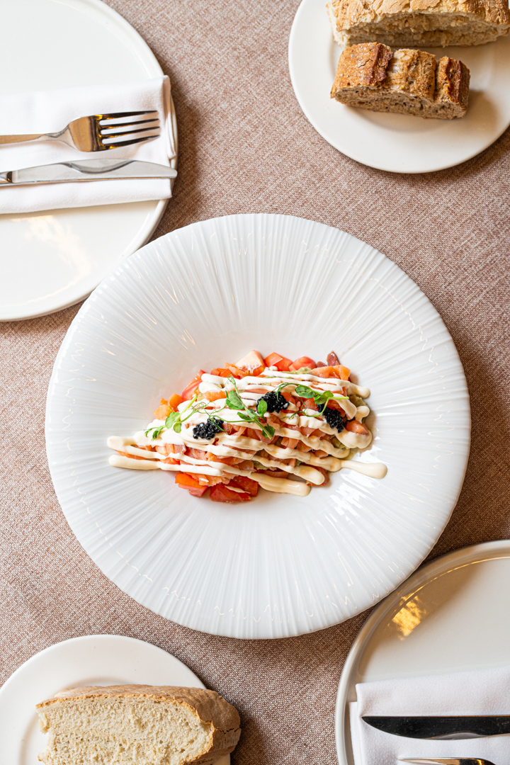 Tomato salad with smoked salmon, avocado and kimchi mahonesa