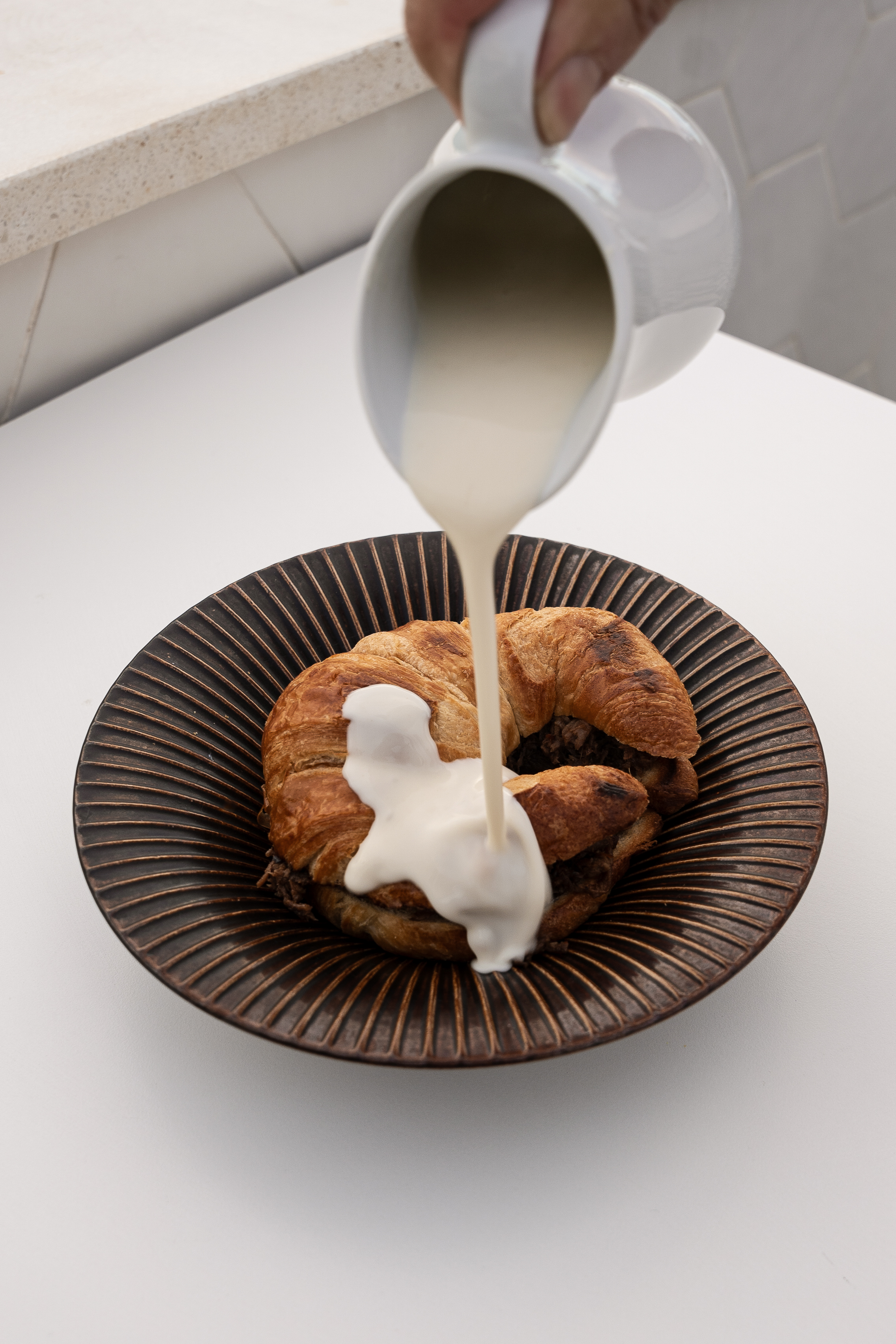 Oxtail croissant glazed with parmesan veloute