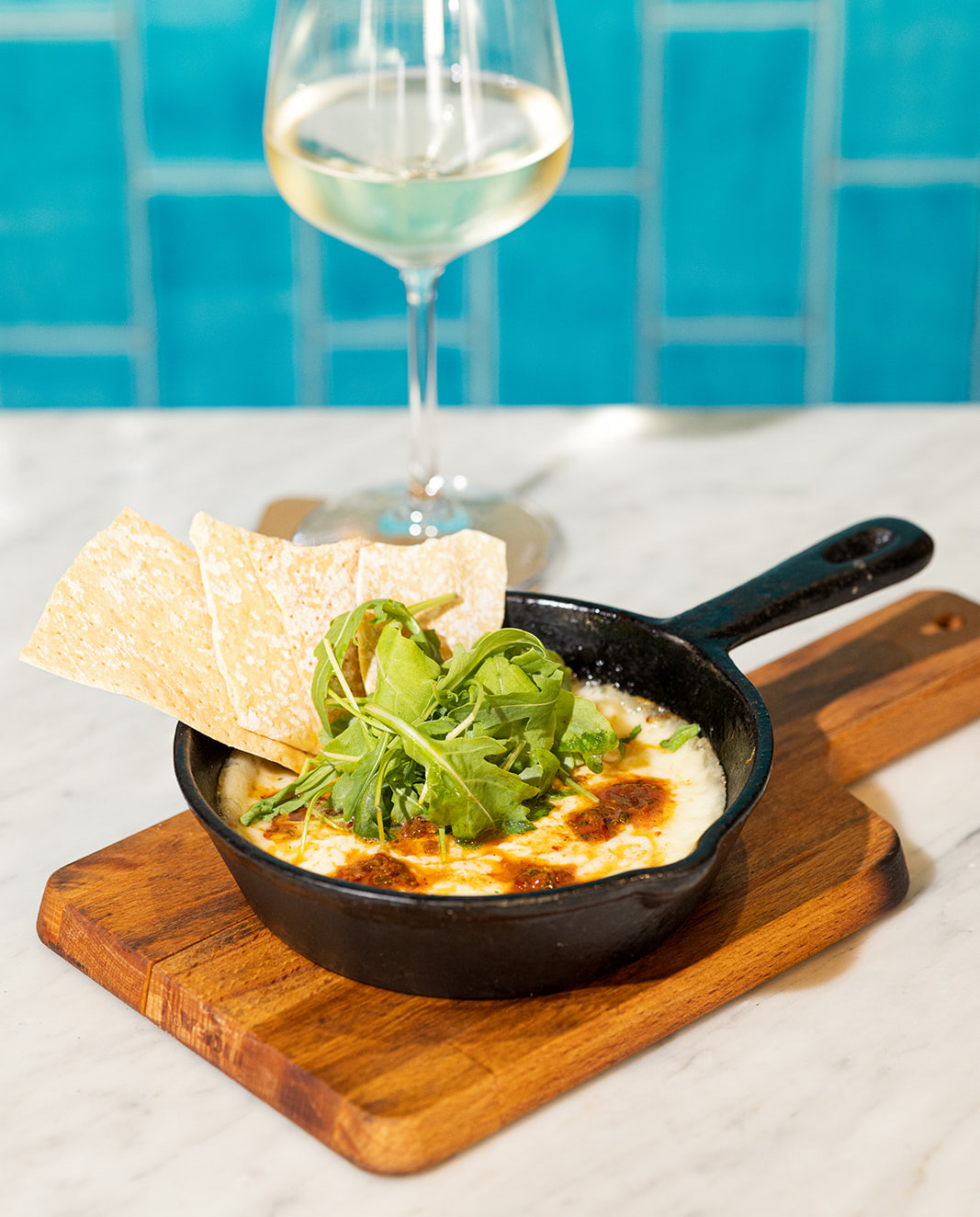 Grilled provolone cheese with herbs “chimichurri” sauce