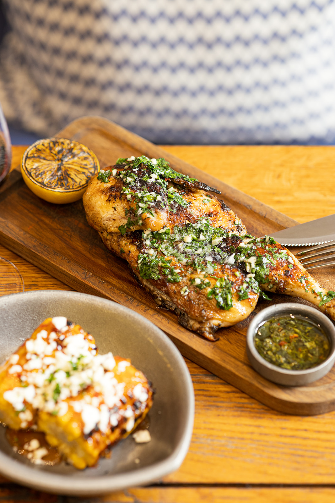 Half grilled chicken with fresh herb chimichurri