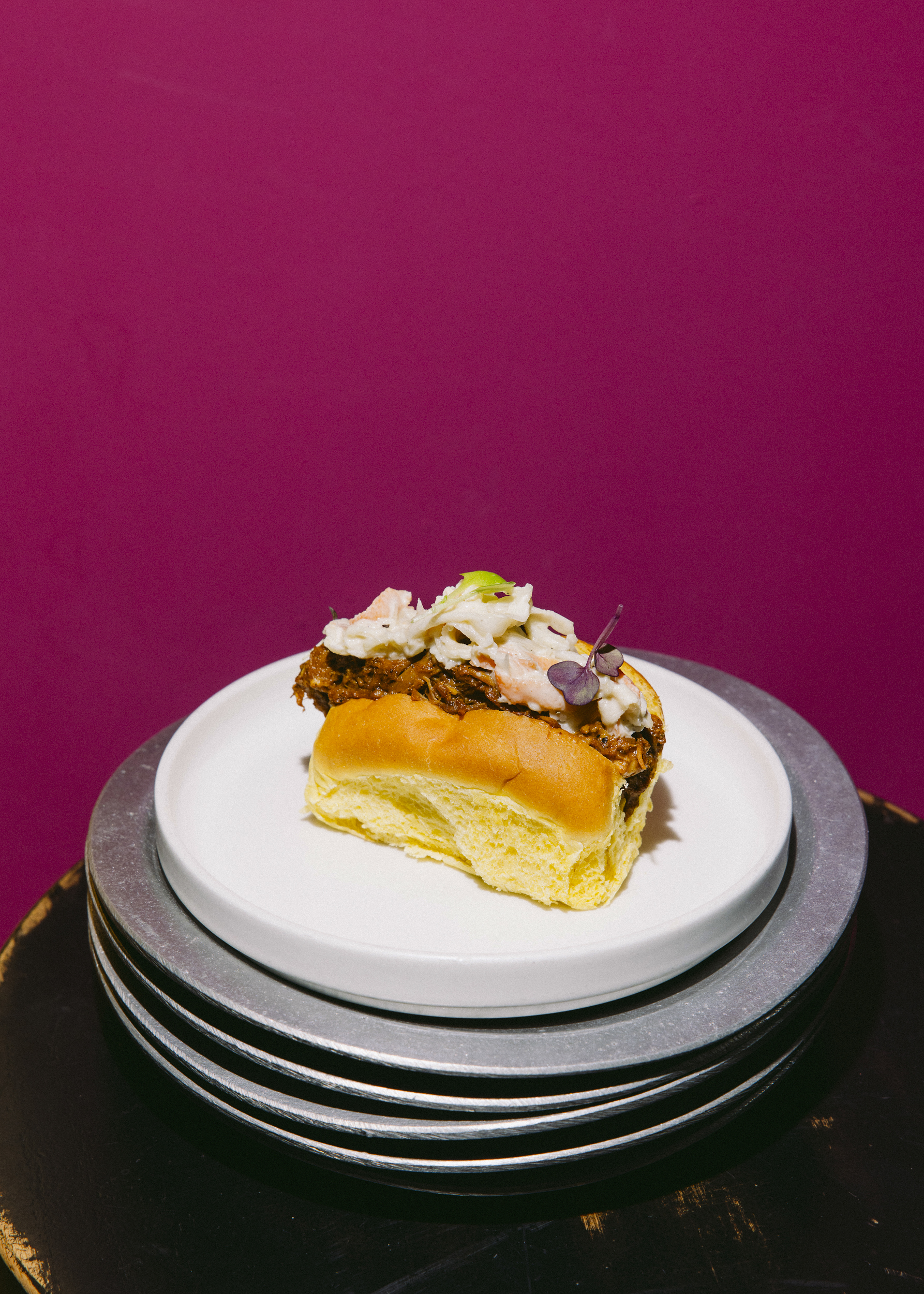 Brioche with pulled pork and coleslaw salad