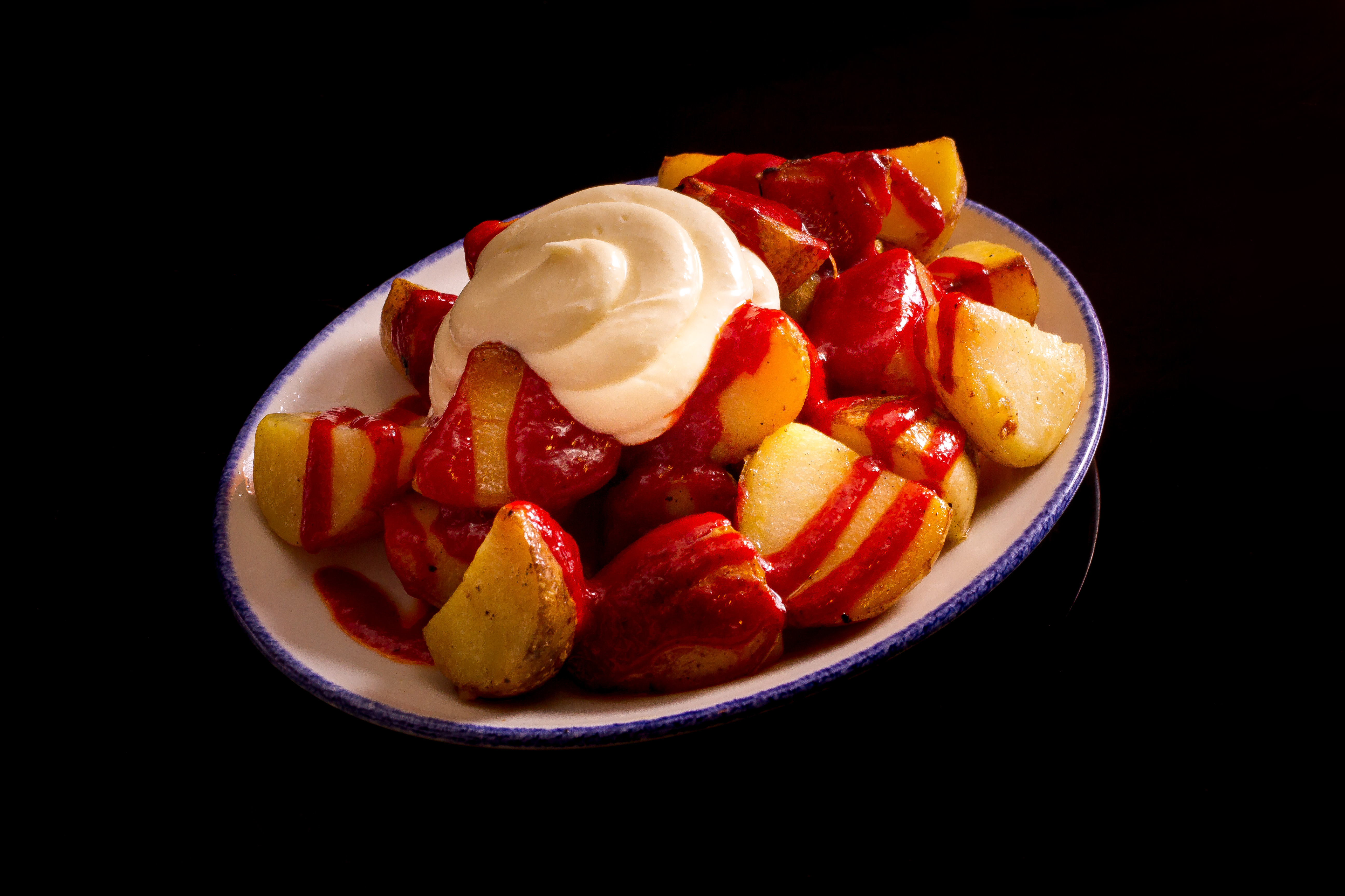 "Bravas" fried potatoes with allioli & spicy sauce