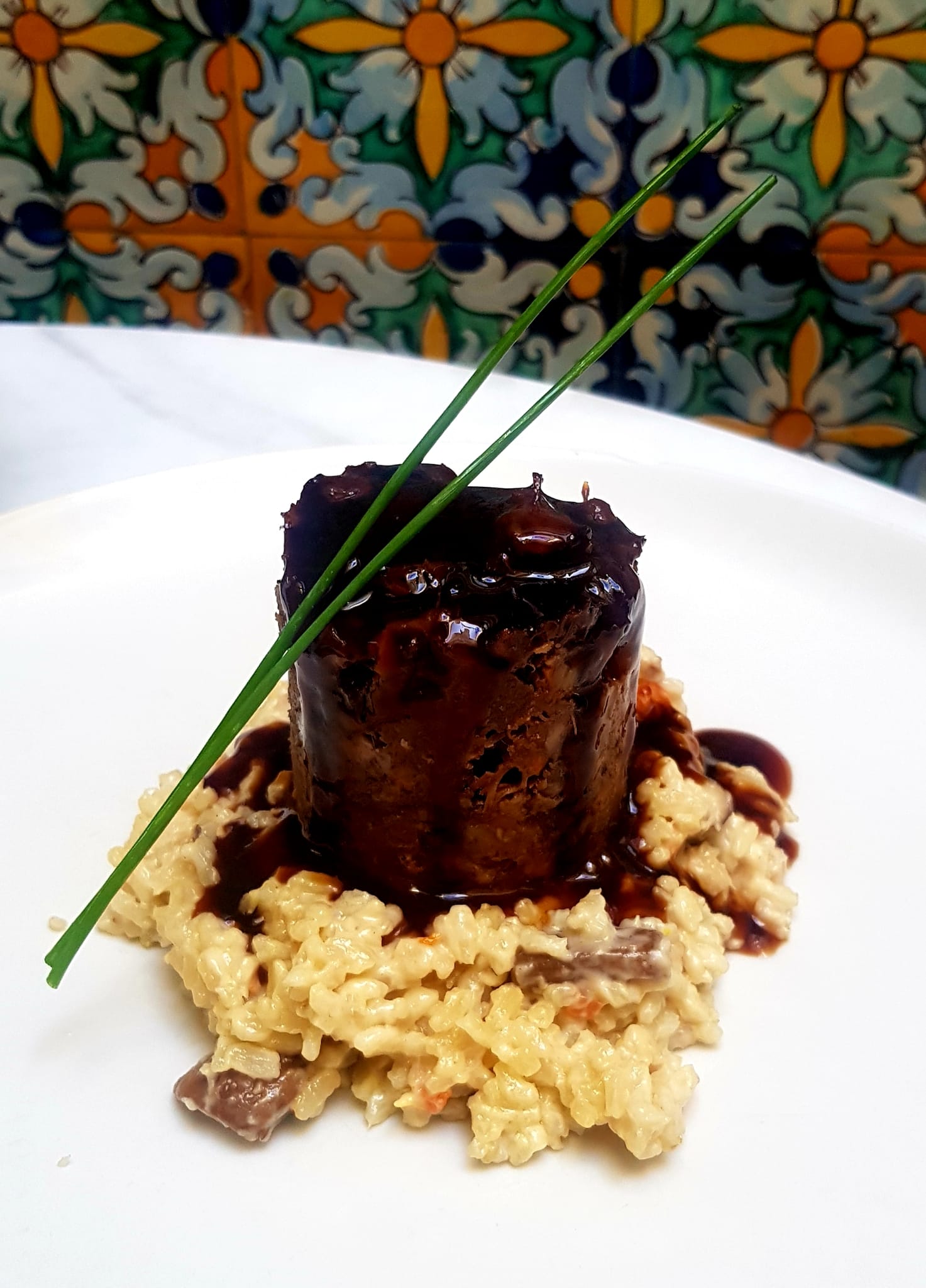 Bull tail timbale with vegetable risotto