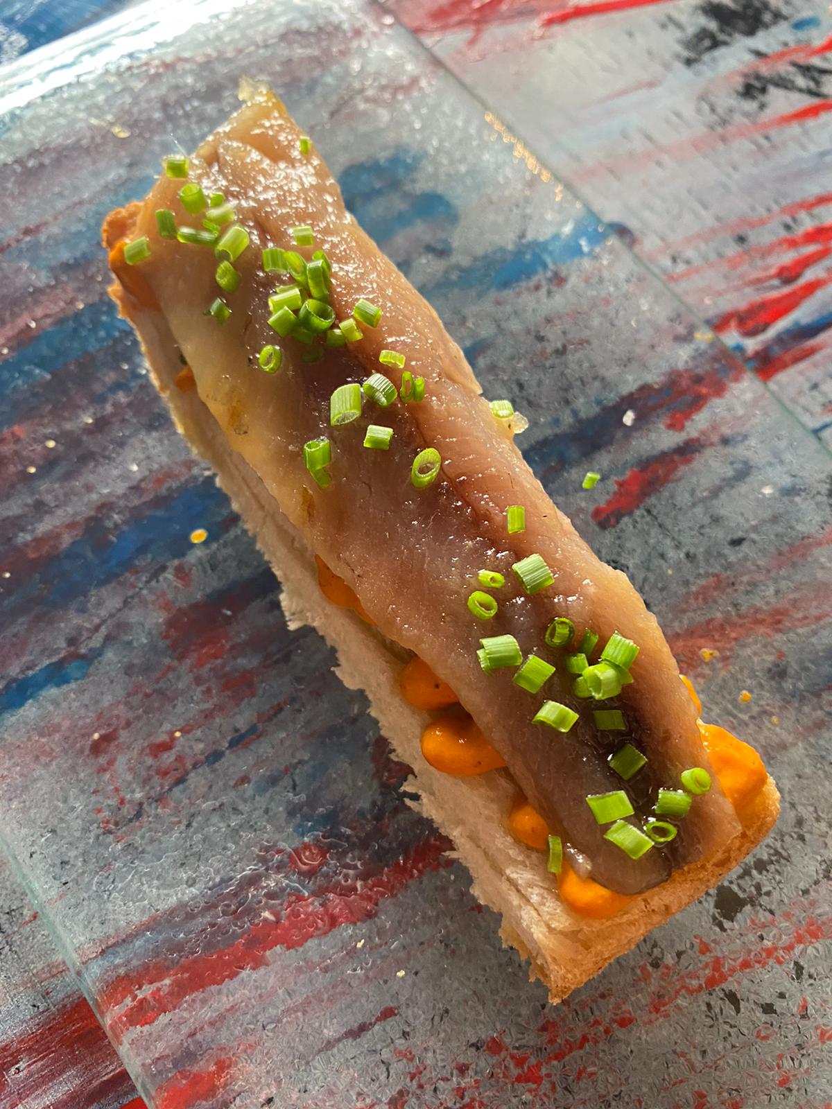 Smoked anchovy toast with romescu sauce