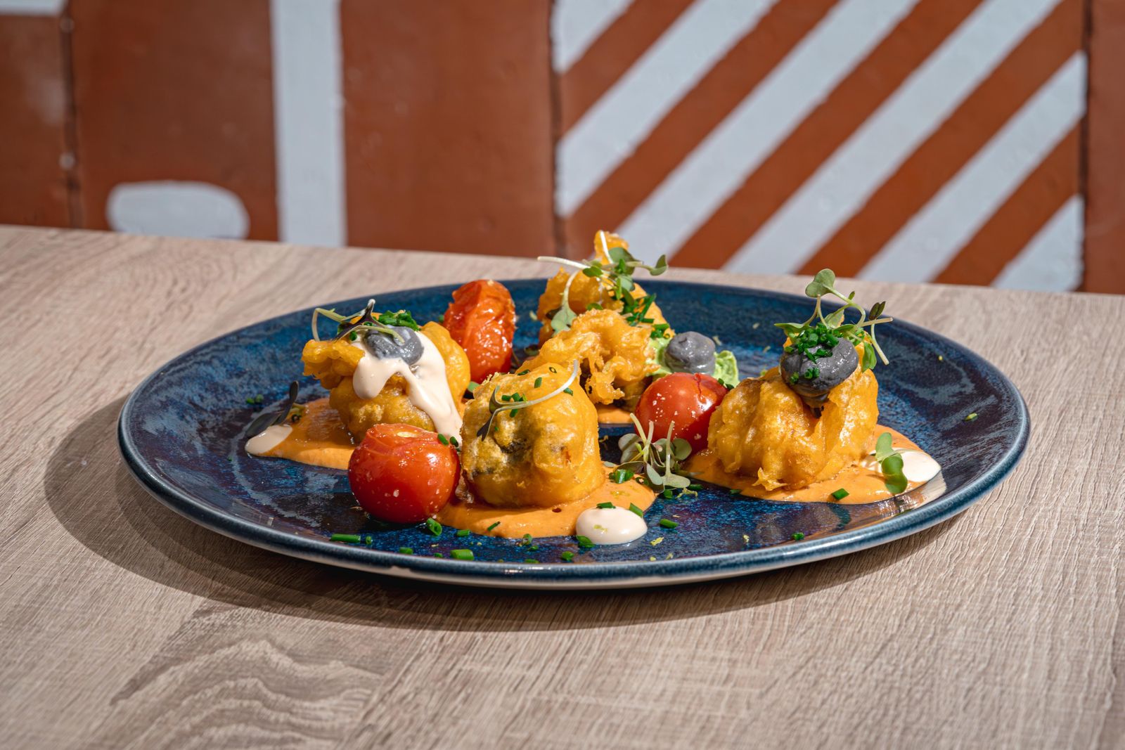 Tempura hake on seafood foam