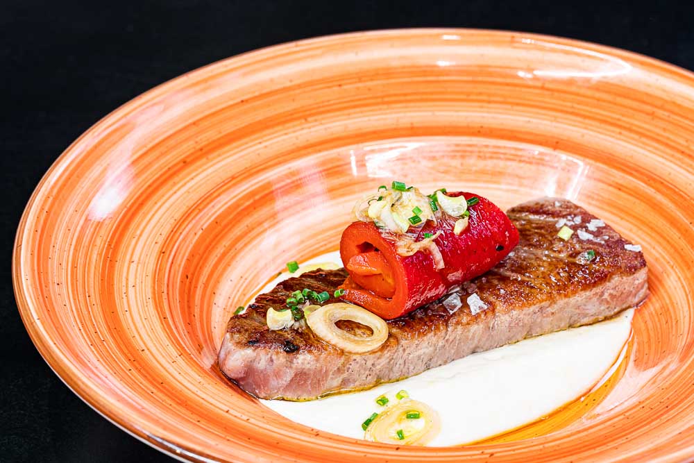 Grilled tuna belly with potato cream and artichokes