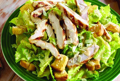 Caesar salad with romaine lettuce, croutons, chicken, parmesan cheese and anchovies.