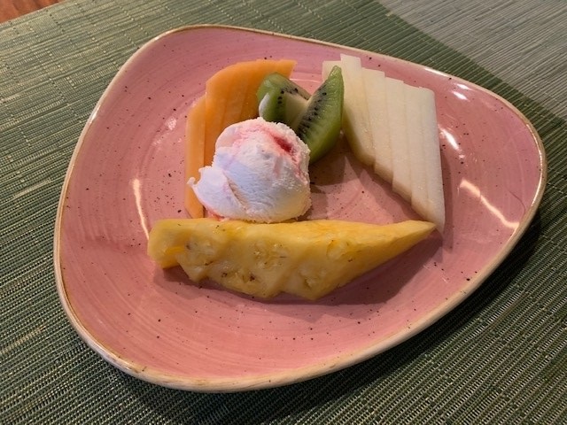 Selected fruits with creamy yoghurt and fresh mint