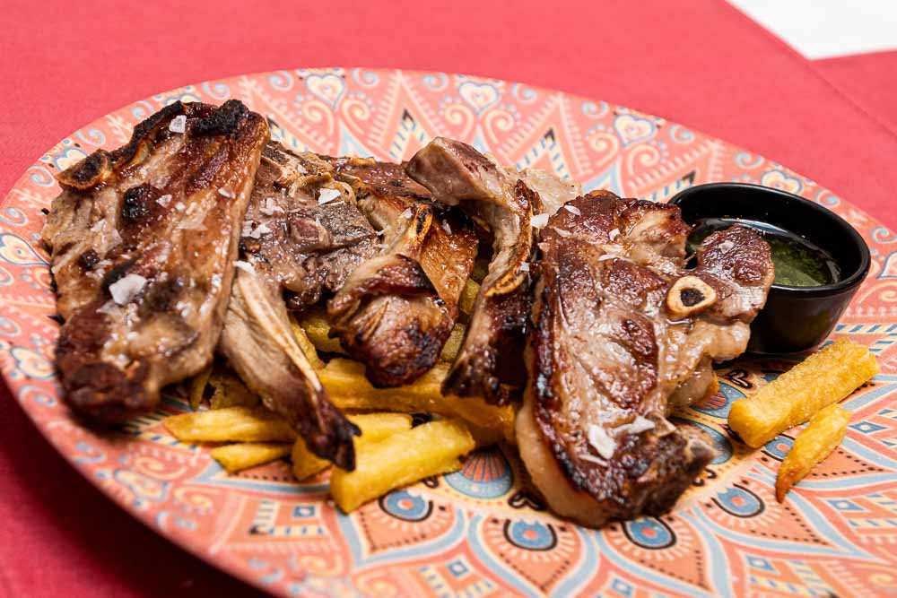 Lamb chops with green sauce and french fries