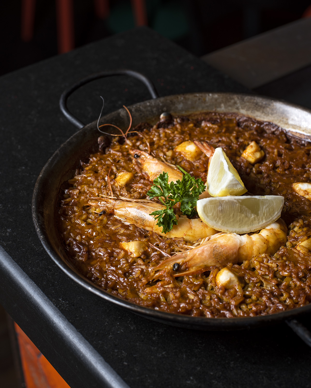 Paella with squid, prawns and butterfish