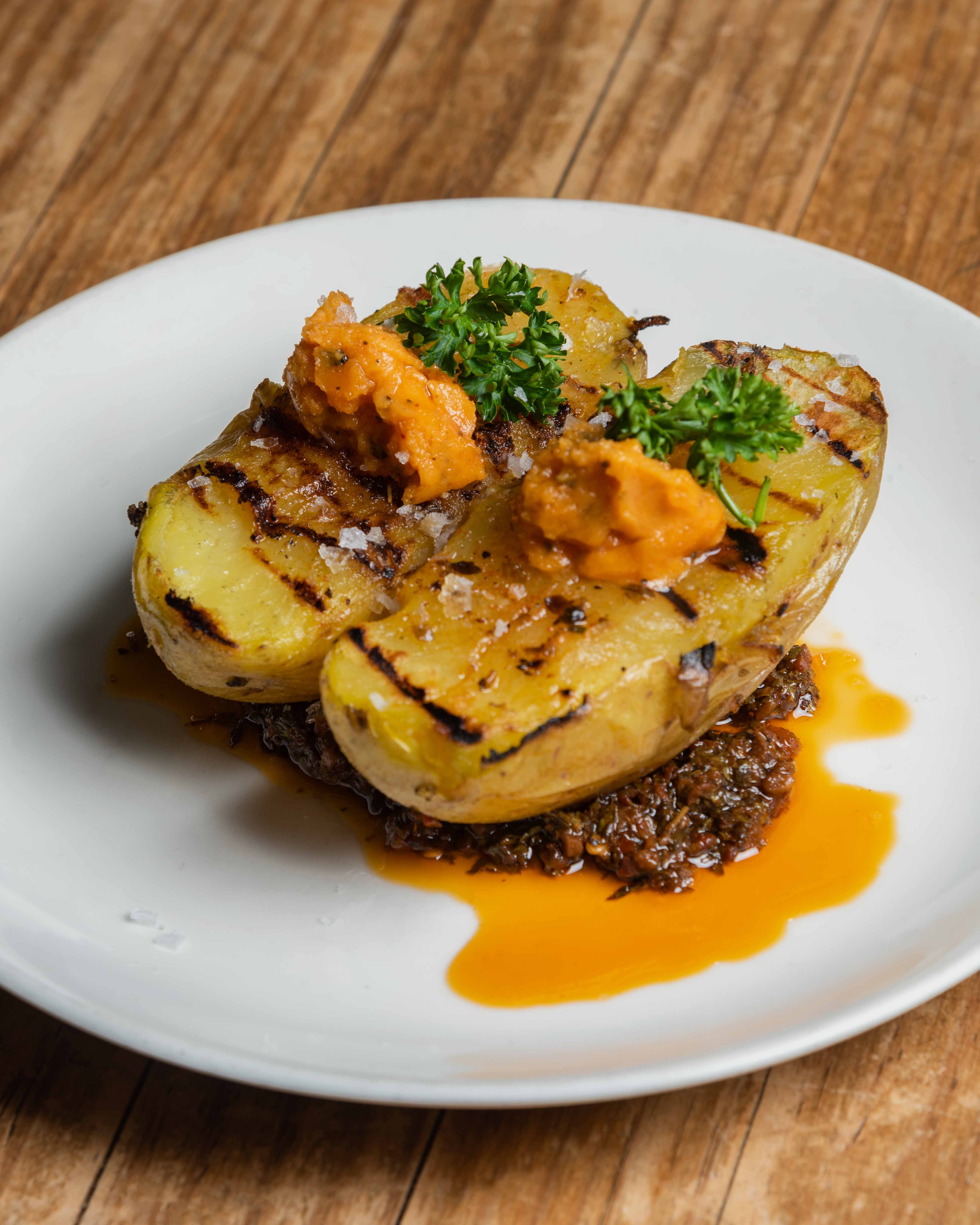 Potato roasted on the coals with butter and herbs