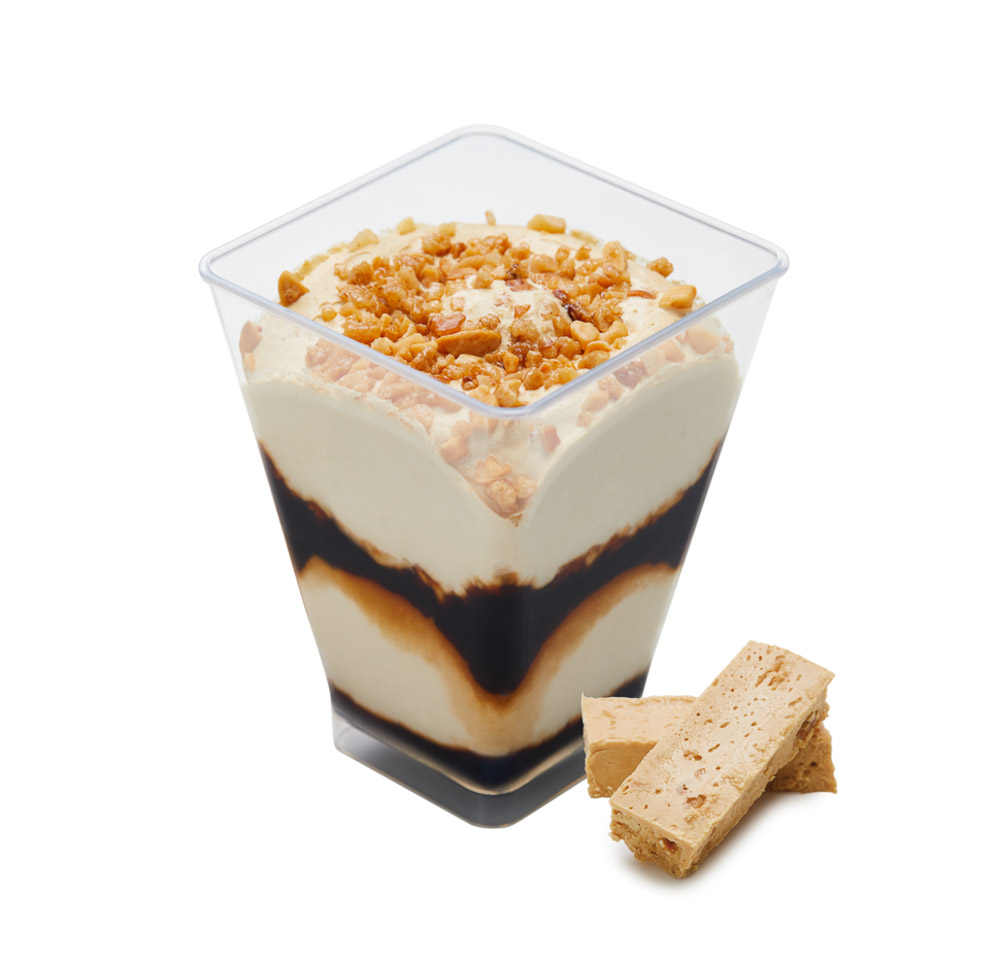 Nougat ice cream with toasted almond pieces and caramel sauce.